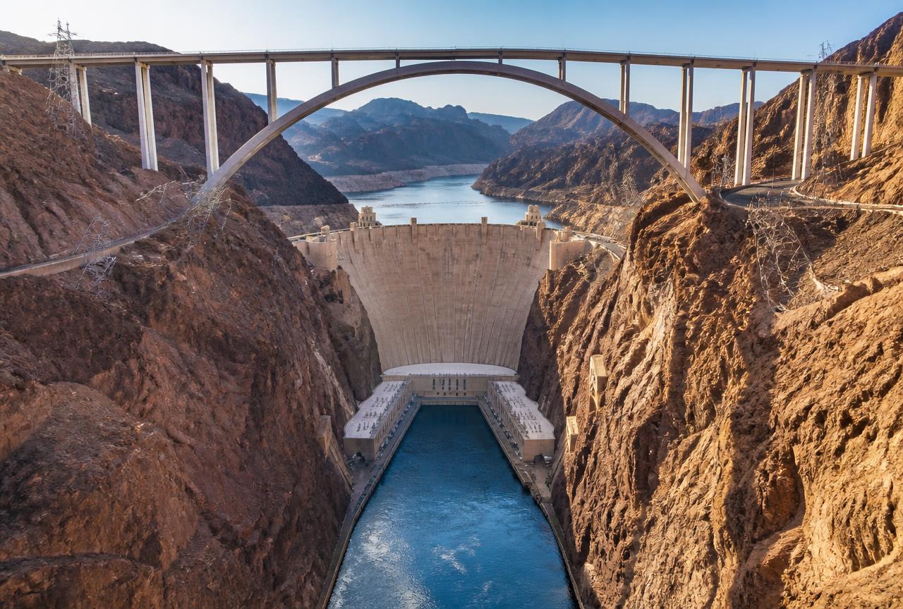 Hoover Dam in Black Canyon with the memorial bridge arch above the Colorado River